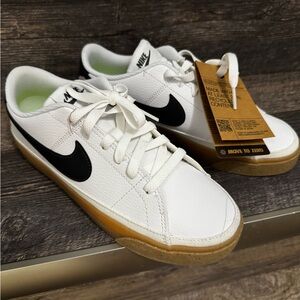 Nike White Sneakers with Black Accents and Neon Green Detail